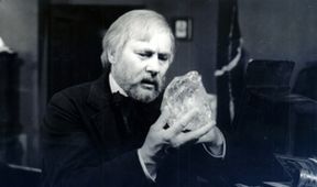 Profesor na bielom koni